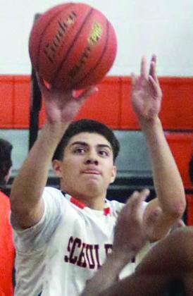 Victor Mandujano releases a baseline jumper for two points in the fourth quarter. Sticker Photo By Darrell Vyvjala