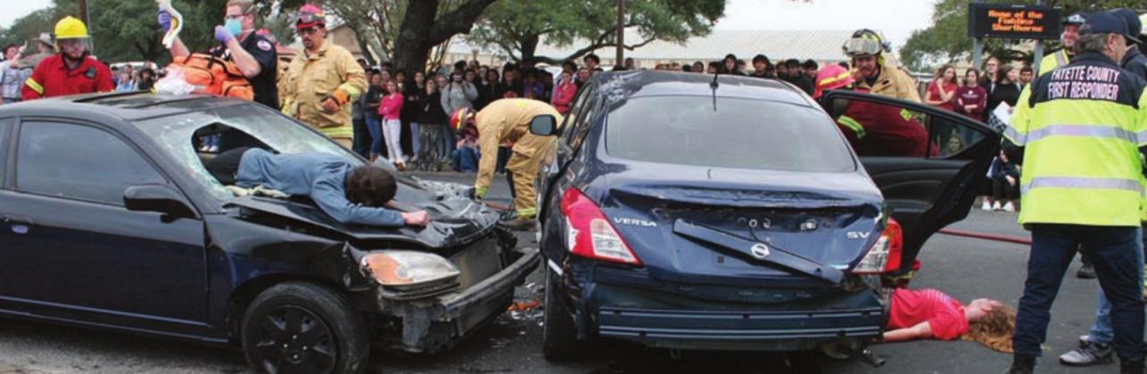 EMS, First Responders, and firefighters work the two-vehicle “accident.” Sticker Photo By Darrell Vyvjala