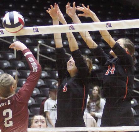Brooke Redding (left) and Emmrie Marx reject a Lady Bulldog attack for a point in game one.
