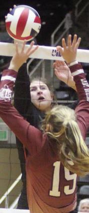 Landry Zapalac tips the ball over in the fourth set. Sticker Photo By Darrell Vyvjala