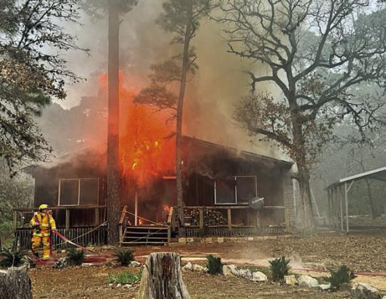 A RESIDENCE in the Clear Lake Pines subdivision was a total loss following a fire on Wednesday, Jan. 8. The Winchester Volunteer Fire Department was dispatched to the scene, with mutual aid provided by the La Grange VFD and South Lee County VFD. Photos Courtesy of Fayette County Sheriff's Office