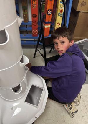 Hayes Kridel spent a day during his spring break helping put together the tower garden at Senior Connections that had a spring cleaning.