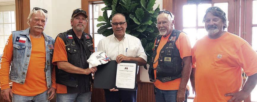 Presentation to Fayetteville Bank – From left: Dallas Canada and Gerald Smith, representing the American Legion Riders; Steve Ulrich, representing Fayetteville Bank; and Herb Fish and Mike Lonkouski, representing the American Legion Riders.