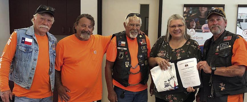 Presentation to Prosperity Bank – From left: Dallas Canada, Mike Lonkouski and Herb Fish, representing the American Legion Riders; Missy Thomas, representing Prosperity Bank; and Gerald Smith, representing the American Legion Riders.
