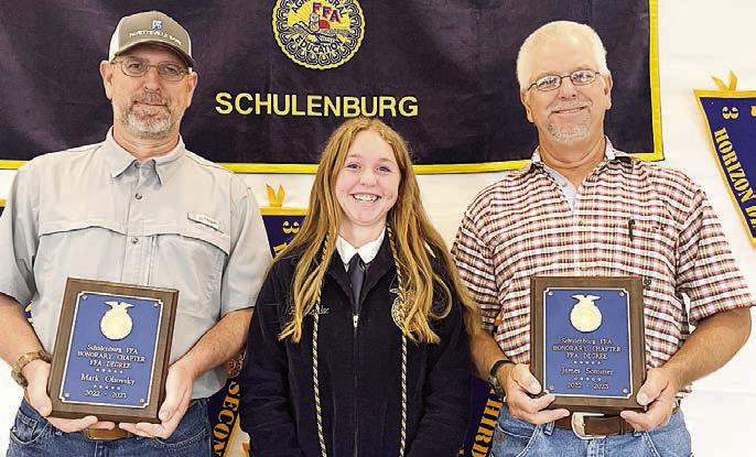 Honorary Membership – Mark Olsovsky, recipient; Harly Zapalac, FFA president, making the presentation; and James Sommer, recipient.