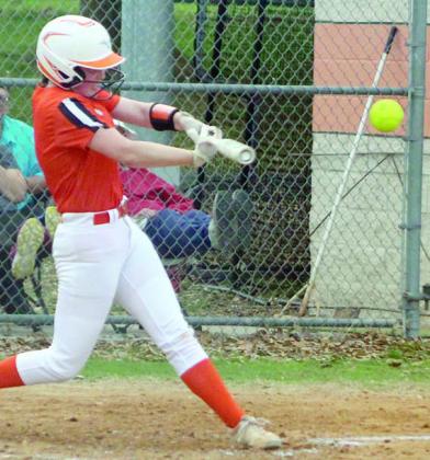 Haylie Goode sends a line drive to left field for a triple against Flatonia. Sticker Photo By Darrell Vyvjala