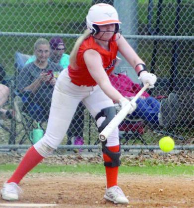 Angel Davis drops down a bunt to drive in a run last Tuesday. Sticker Photo By Darrell Vyvjala