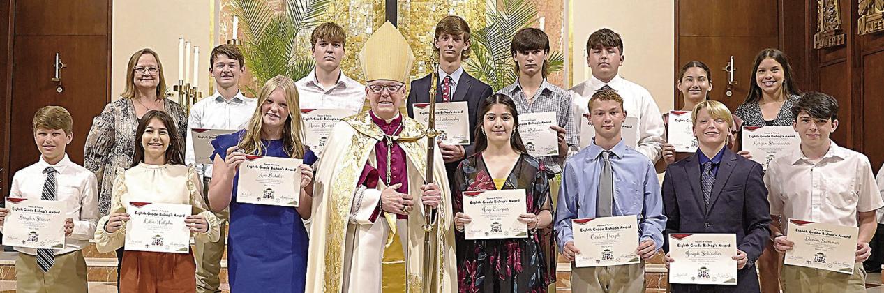 Bishop’s Award recipients FROM ST . ROSE OF LIMA CATHO LIC SCHOO L, shown with the bishop and school principal, were (front row, from left) Brayden Stoever, Lillia Wotipka, Ava Bubela, Bishop Brendan Cahill, Joseline Campos, Caden Herzik, Joseph Schindler, Denim Sommer, (back row) St. Rose principal Rosanne Gallia, Dillon Goedrich, Mason Kunschick, Connor Lichnovsky, Brant Redman, Ian Reeves, Ava Slaton and Morgan Steinhauser.