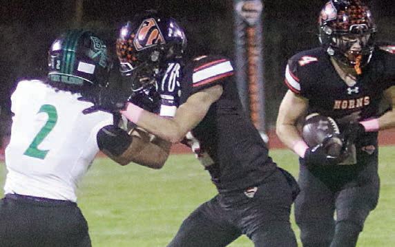 Denver Carr throws a block to spring Jayse Janda on a 9-yard gain in the third quarter. Sticker Photo By Brandt Vyvjala
