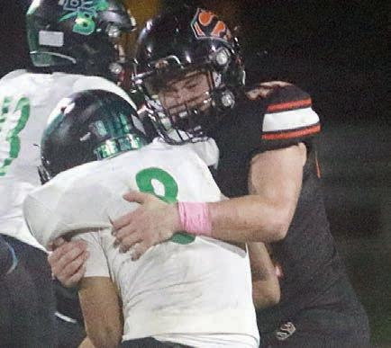 Aidan Mendez takes down the Bobcats’ quarterback in the fourth quarter. Sticker Photo By Brandt Vyvjala