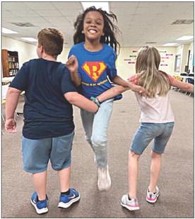 During free time, Boys &amp;amp; Girls Club members like to play different types of games. Last week, members at the Schulenburg Unit played Red Rover and had the best time! Shown are (from left) Club members Colton Shiller, Angelica Brito and Layla Cowgill.