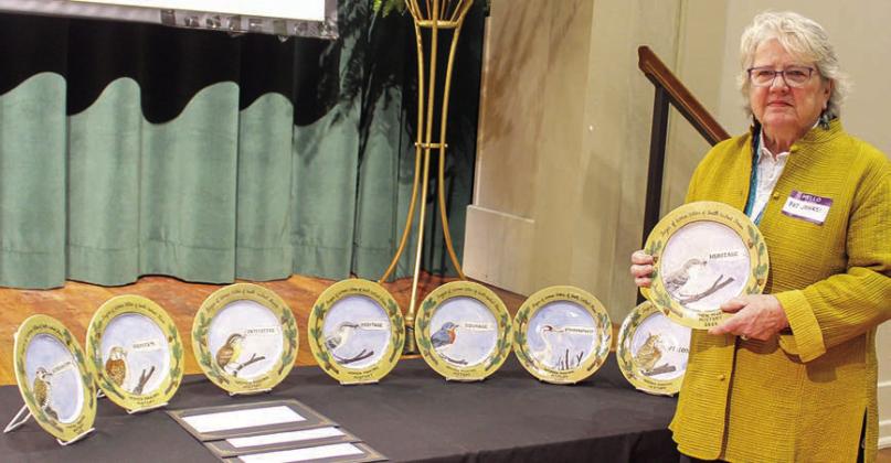 Artist Pat Johnson poses with the commemorative plates she designed and crafted that were presented to the Women Making History honorees. SHS one-act play competes at district