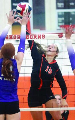 Kimber Bartosch goes for a kill in game three against the Lady Brahmas. Sticker Photo By Darrell Vyvjala