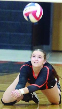 Kerr McBride dives to get to a short served in the first set against Stockdale. Sticker Photo By Darrell Vyvjala