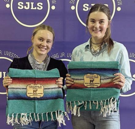 Heifer – grand champion Madyson Holub (right) and reserve champion Keeley Warnken (left).
