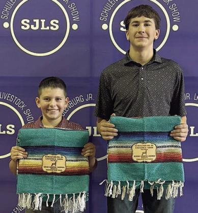 Goat – grand champion Hudson Holub (left) and reserve champion Koi Prihoda (right).