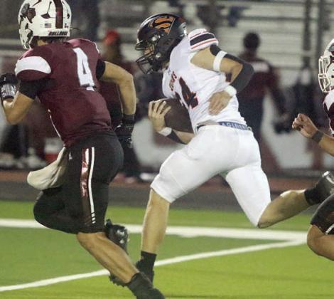 Mason Kunschick breaks into the open on his way to a 59-yard touchdown run in the third quarter. Sticker Photo By Darrell Vyvjala