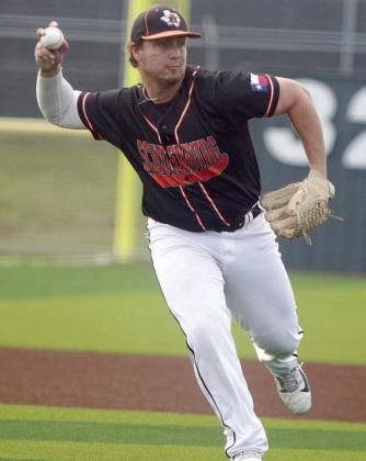 Third baseman Tyson Wagner throws on the run after fielding a slow grounder in game two. Sticker Photo By Darrell Vyvjala