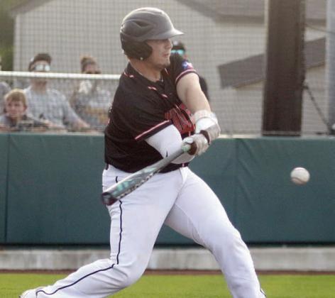 Tyson Wagner sends a single up the middle in game three. Sticker Photo By Darrell Vyvjala