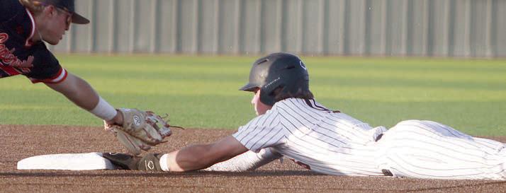 Jayse Janda slides into second with steal in game one. Sticker Photo By Darrell Vyvjala