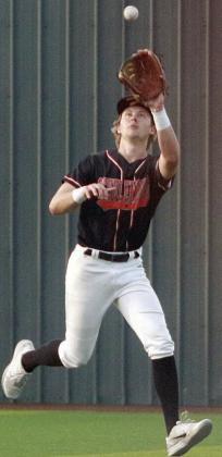 Aaron Janecek makes a running catch in right-centerfield in game three. Sticker Photo By Darrell Vyvjala