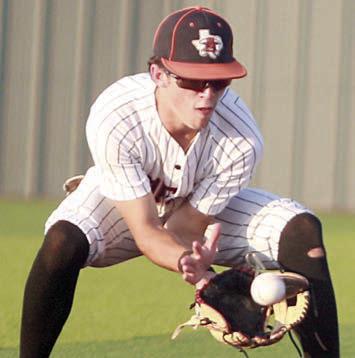 Second baseman Cooper Demel looks a drounder into his glove in game one. Sticker Photo By Darrell Vyvjala