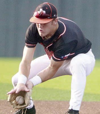 Shortstop Reid Janda scoops up a ground ball in game two. Sticker Photo By Darrell Vyvjala