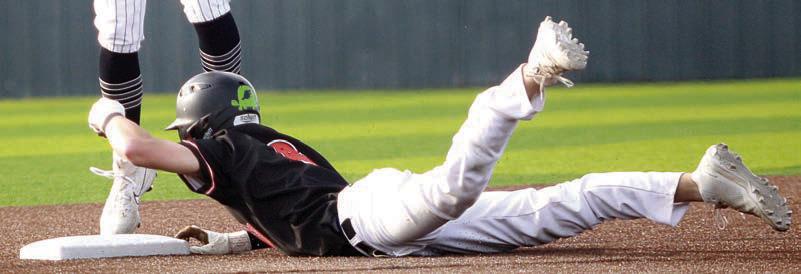 Zane Brenek slides into second base with a double in game three. Sticker Photo By Darrell Vyvjala