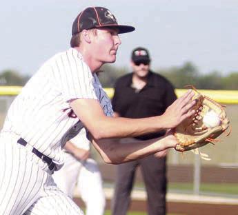 Pitcher Owen Brenek fields a come-backer in the second inning of game one. Sticker Photo By Darrell Vyvjala