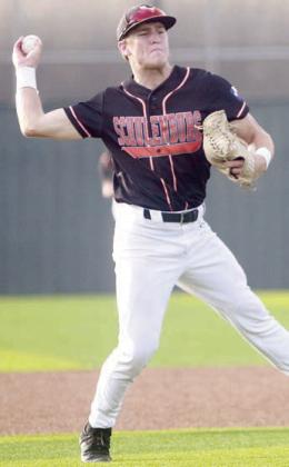 Shortstop Reid Janda fires on the run to first base in game two. Sticker Photo By Darrell Vyvjala