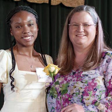 Mikhayla Stafford-Bedford (left) of Yoakum honored band director Dr. Jennifer Voges.