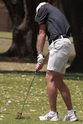 Jayse Janda hits his approach shot on No. 11 at the district tournament. Sticker Photo By Darrell Vyvjala