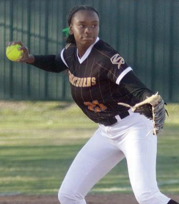 Third baseman Jashiya Jackson throws to first base for an out last Tuesday. Sticker Photo By Darrell Vyvjala