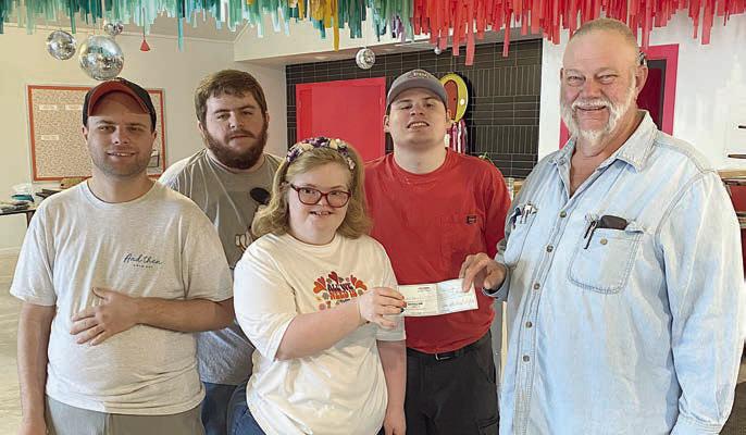 For “Join Hands Da y,” Hermann Sons Life Lodge 14 made a donation to And Then A New Day. Shown are (front row, from left) Ty Janak, Presley Foster, (back row) Logan Carrol and Harry Titmus. Presenting the check was Lodge 14 president Ed Moeller (right).