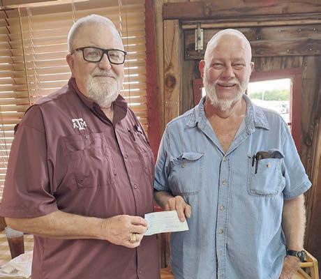 Texas Ramp Project, represented by regional project manager J. Frank Smith (left), received a donation from Hermann Sons Life Lodge 14, represented by president Ed Moeller (right).