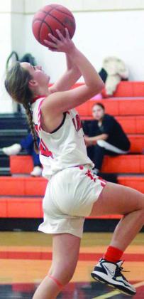 Miranda Bonner goes up for a layup after a steal in the second half last Tuesday. Sticker Photo By Darrell Vyvjala