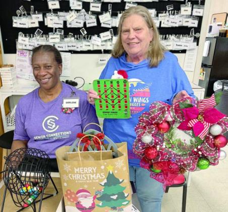 The grand prize winner in Schulenburg for the bingo game was Annette Jasek (right). Not only did she win the blackout prize, a beautiful wreath made by Martha Beckmann, but she also won a bag of holiday goodies for the big picture frame, too. Darlene Williams (left) called the game.