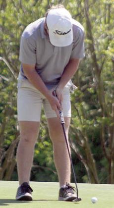 Brycen Schramek strokes a birdie putt on hole No. 13. Sticker Photo By Darrell Vyvjala