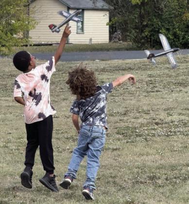 “Future pilots” enjoy playing with foam flyers.