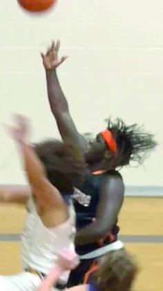Rodney H Walton drives to the basket in the Horns’ season opener in La Grange.