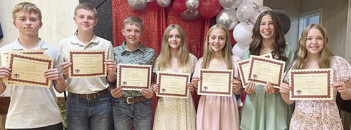 Top Eighth Grade Students – (from left) Weston Hollas, Algebra I (tie), science, English and social studies; Bo Brossmann, Algebra I (tie); Holden Holub, band (tie); Mallory Bonner, reading; Tenley Zbranek, yearbook and band most improved; Courtney Magliolo, religion and band (tie); and Reese Dusek, math.