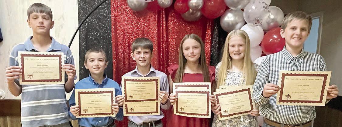 Top 6th Grade Students – (from left) Jacob Schramek, technology; Gage Smrkovsky, band most improved; Luke Goedrich, math and social studies; Kynslee Zapalac, religion and band; Briley Hartensteiner, reading, science and English; and Levi Johnson, speech.