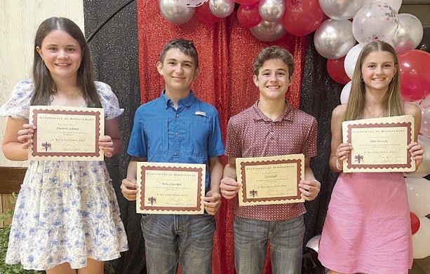 Top 7th Grade Students – (from left) Charlotte Schmidt, religion; Dylan Zweschper, geography; Cal Schiffli, math, reading, science, Spanish and band most improved; and Clare Besetzny, reading, English, social studies and band.