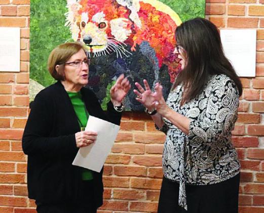 New CVQG president Gay Dobbs (left) speaks with Deborah Bradley (right), Texas Quilt Museum director. Bradley hosted the CVQG on Sept. 26.