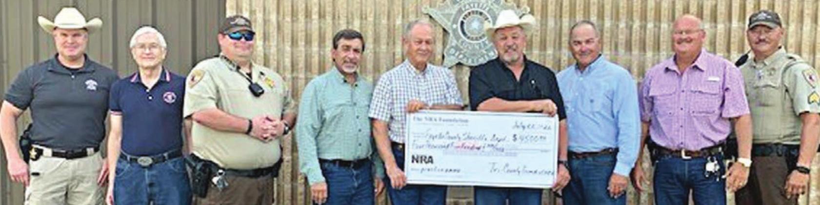 NRA Foundation and Friends of NRA recently presented a $4,500 grant to the Fayette County Sheriff's Office, with the following representatives on hand: (from left) Investigator Kenn Kretz, Charles Murray-Friends of NRA, Deputy Lee Phillips, John Salem-Friends of NRA, Dennis Brower-Friends of NRA, Sheriff Keith Korenek, Craig Schulz-Friends of NRA, Lt. David Beyer and Sgt. Ron Naumann.