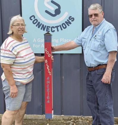Thanks – As a token of appreciation to the City of Schulenburg, Senior Connections gifted this garden pole to Mayor Connie Koopmann (left) and City Council member Clarence Ahlschlager (right), both of whom are members of the Senior Connections board.