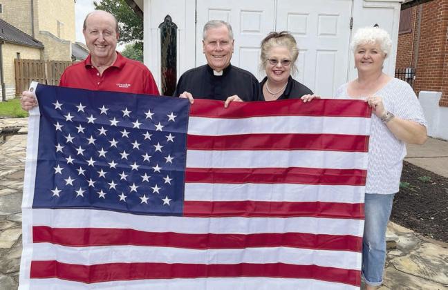 Catholic life donates flag to st. Rose