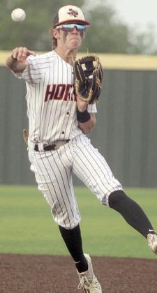 Second baseman Cooper Demel makes an off-balance throw for an out after charging a slow grounder in game one. Sticker Photo By Darrell Vyvjala
