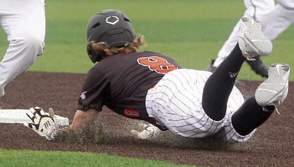 Aaron Janecek dives into second with a stolen base in the top of the third inning of game three.