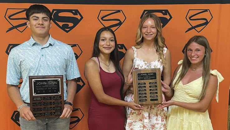 CROSS COUNTRY – (from left) Victor Mandujano, John Ginn Boys’ Cross Country Award; Ana Maria Granados, Michaela Kollmann, and Ellie Hammack, John Ginn Girls’ Cross Country Award. Sticker Photo By Darrell Vyvjala